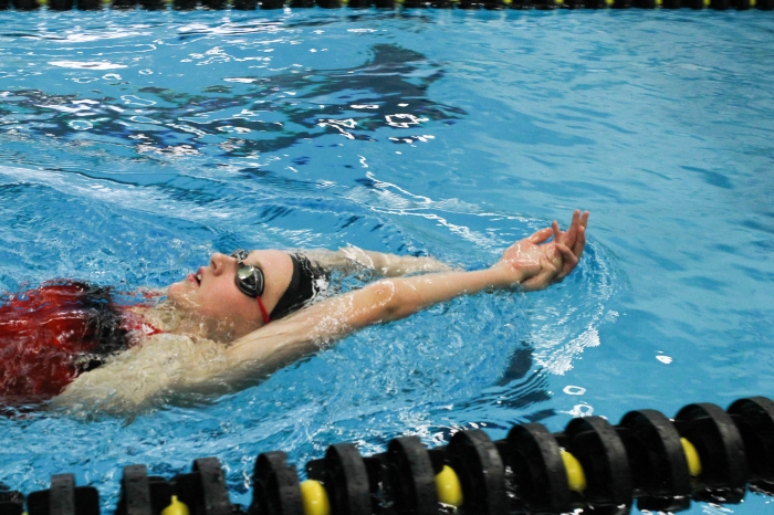 Freshman Emily Kliewer practices backstroke, Friday at UI Swim Center.